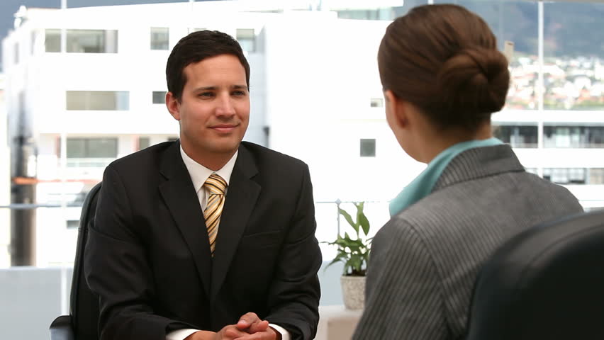 Interview between a man and a woman in an office