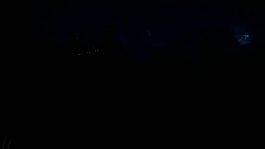 Lightning strikes over derelict church spire 