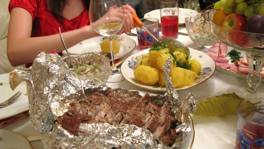 View on piece of roasted meat on table at some banquet, time lapse 