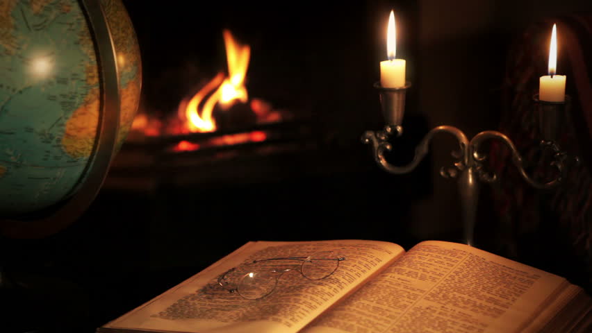 Terrestrial globe and old book and glasses.
