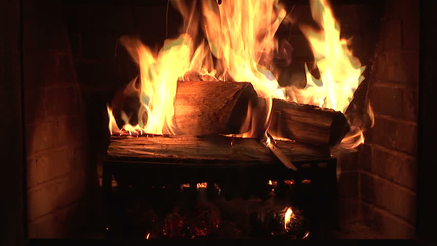 A fire starts to burn in a fireplace