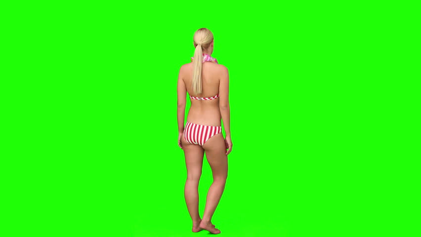 Chromakey footage of a pretty blond woman saying goodbye to somebody
