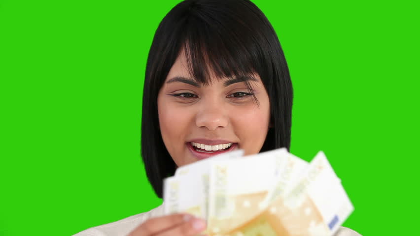 Chroma-key footage of an asian woman proud of what she earned