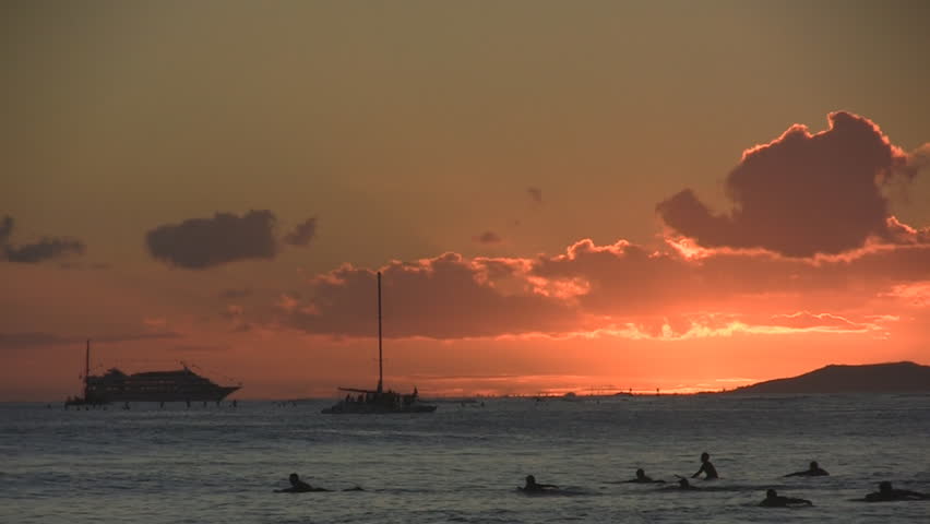 Sunset surfers at Waikiki.