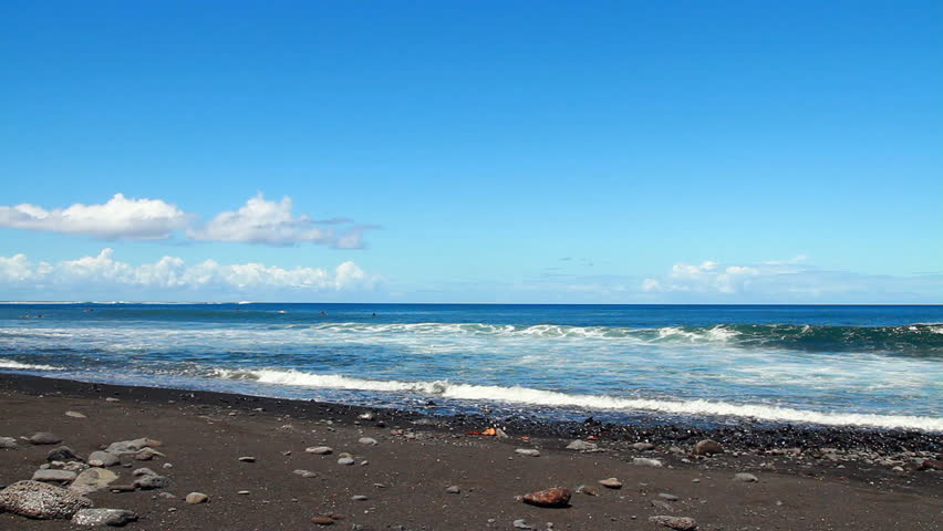 Waves on black sand beach, Tahiti island, Polynesia.