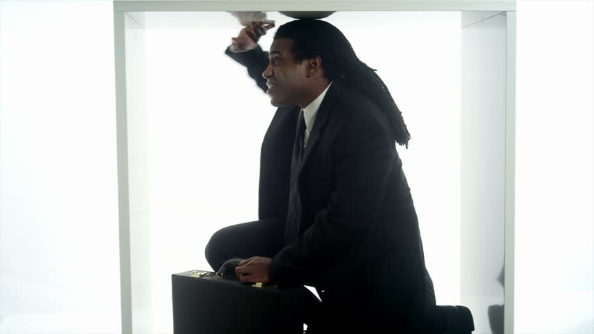 An African man trapped in a box 