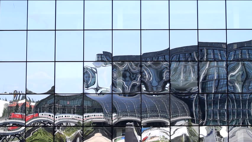 Reflection of Berlin's main railway station "Hauptbahnhof" on the facade of a building