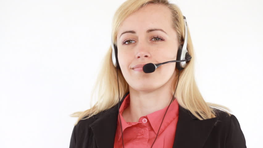 Attractive helpdesk consultant smiling to the camera, isolated on white
