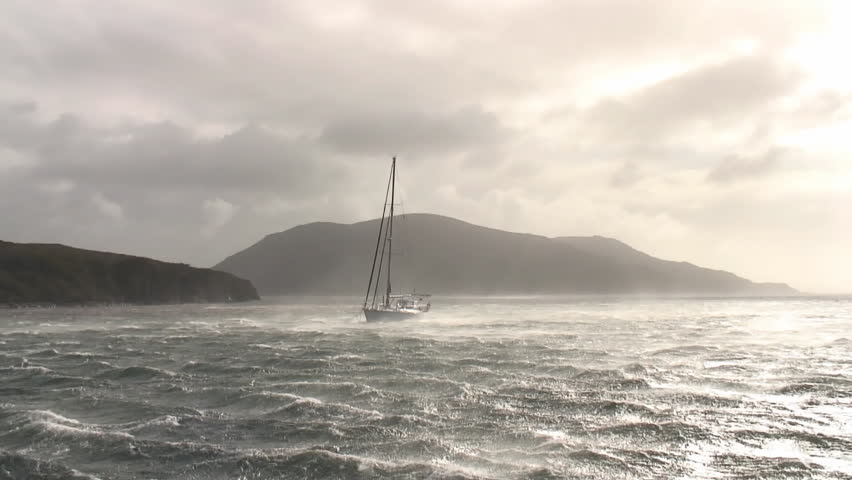 Sailing boat in stormy weather