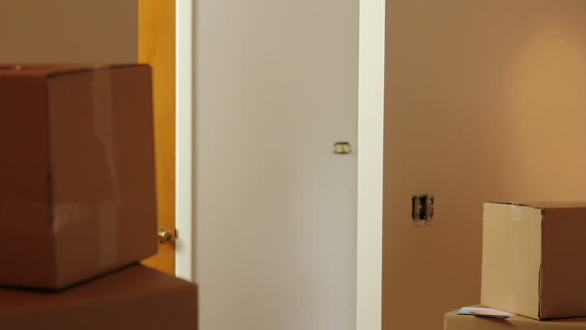 Young couple walking into their first home