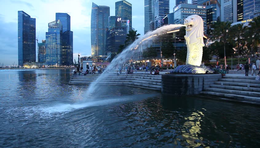 SINGAPORE - DEC 29: The Merlion fountain & Singapore skyline on December 29, 2010. The Merlion is the emblem of the Singapore Tourism Board (STB) and has been a trademarked symbol since July 20, 1966.