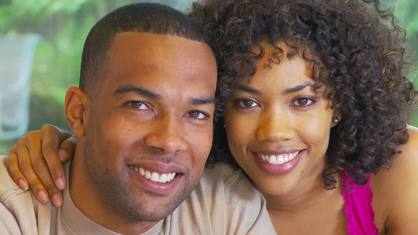 Portrait of African American couple kissing