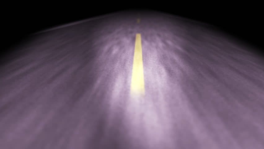 Vehicle travel down foggy night time road. Focused on road. Crosses center dotted yellow line. Surrounding landscape in dark. creating moody, intense and forward thinking scene.