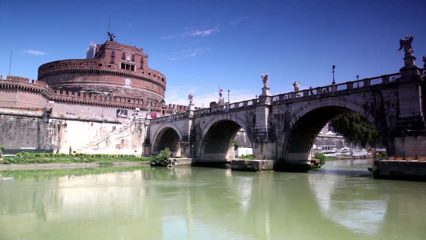 Sant Angelo Castel the view in motion from the river, camera goes under Sant Angelo Bridge and then shows other side