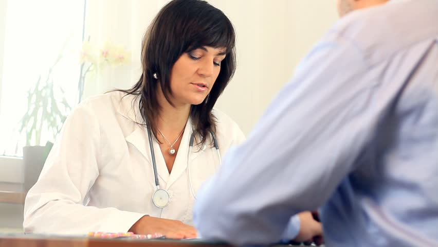 Female doctor telling bad news to male patient