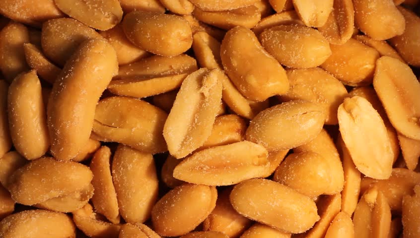 A close-up view of peanuts begin a slow rotation.