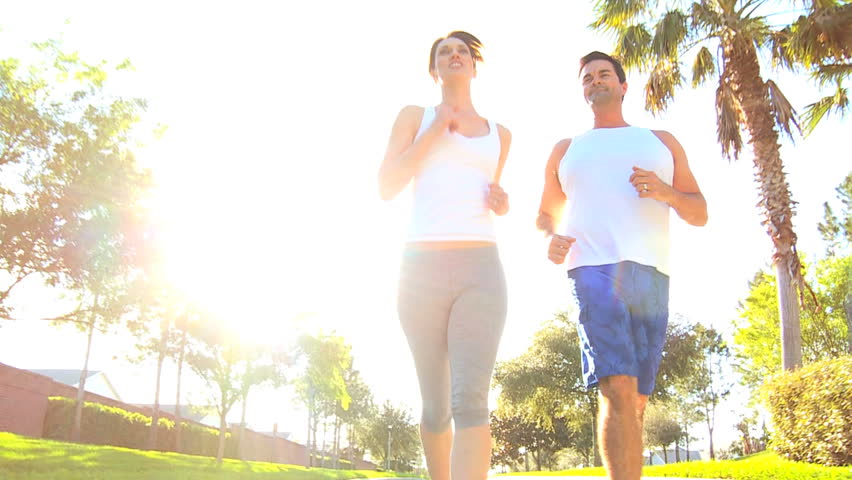 Athletic caucasian couple jogging to keep fit