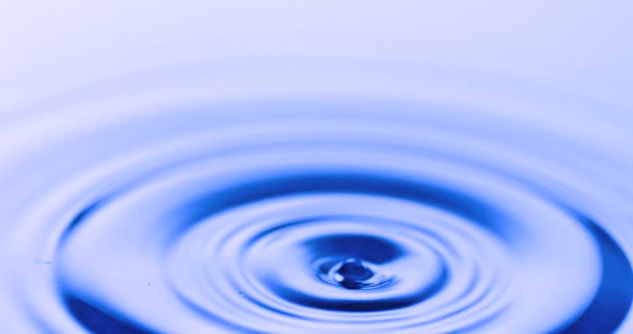 Close-up of dropping water slow motion filmed at 1,000 frame per second
