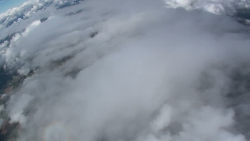 Skydiver in freefall head down been chased by another skydiver  
