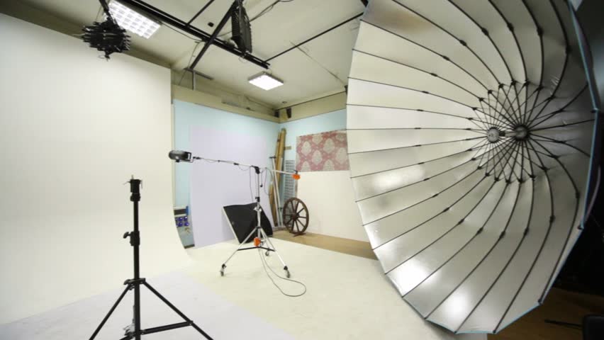 White background inside studio light room with lamps and spotlights