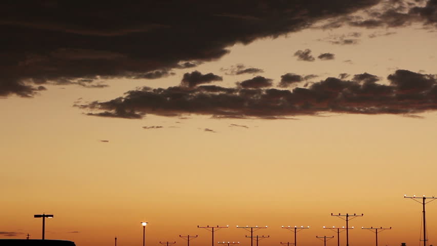Dusk landing of a twin engine passenger jet plane