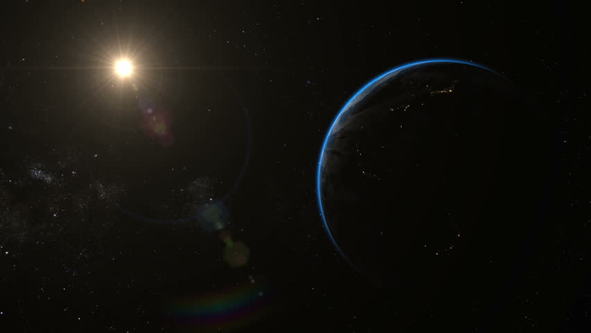 Flight towards the dark side of the Earth. After a very close flyby, the camera rotates to the illuminated side of Earth. The sun creates cinematic lens-flares. Elements of this image furnished by NASA
