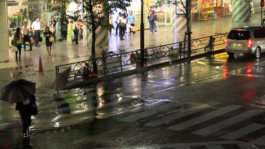 Crosswalk on a street in Tokyo during a typhoon.