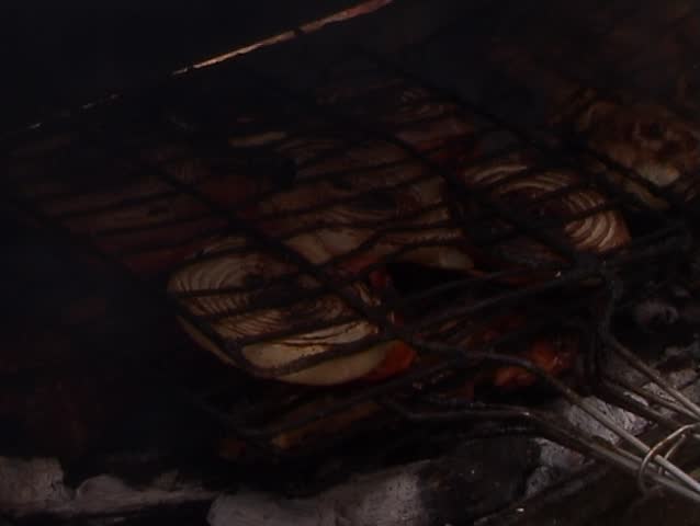 BBQ Ã¢â¬â Moroccan style: Grilled lamb chops with onion and tomatoes 