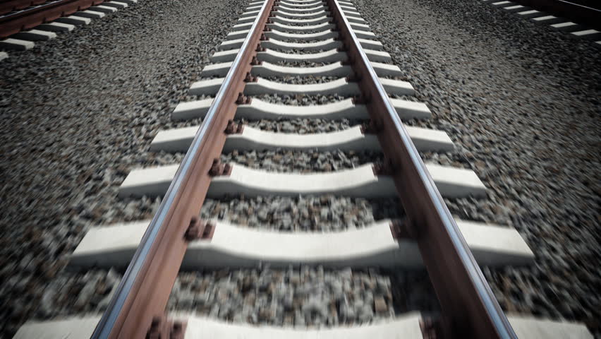 Camera moves along railway. Seamless loop.