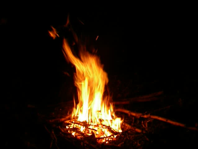 Cozy campfire outdoors in late cold night
