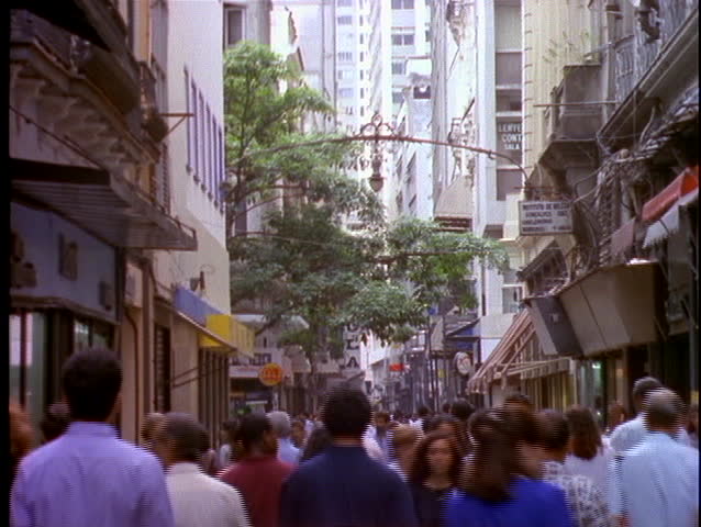 RIO DE JANEIRO - CIRCA 1990's: Pedestrians and shoppers walk through the crowded streets of downtown circa 1990's in Rio De Janeiro, Brazil.