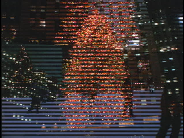 NEW YORK - CIRCA 1990's: Ice skaters circle Rockefeller Center circa 1990's in New York.