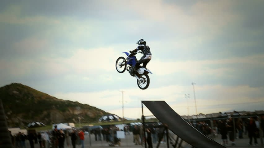 Rider hits small ramp & does headstand in mid-air