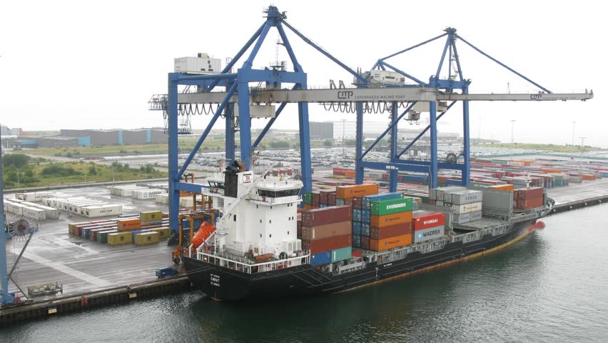 COPENHAGEN, DENMARK - JULY 12: Loading process in port on July 12, 2011 in Copenhagen, Denmark. Denmarks ports handle 109 million tonnes of cargo per year.