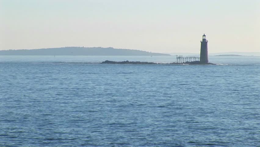 The Portland Head Lighthouse sits on a small island off the Main, New England shore.