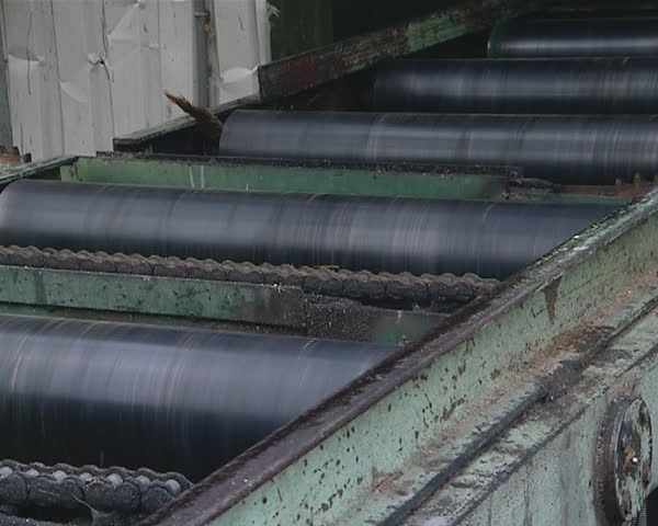 Wooden boards preparation in the sawmill. Timber industry. 