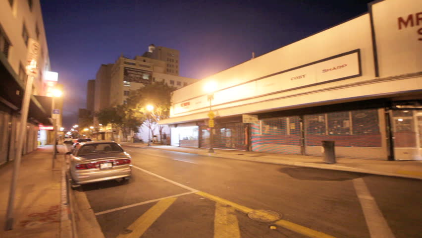MIAMI, FLORIDA - OCTOBER 12: Pan of corner of North East 1st street in downtown Miami at night, October 12, 2011, Miami, Florida, United States.
