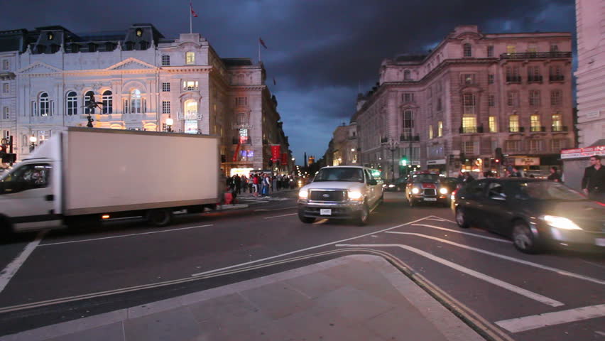 LONDON, UK - JULY 25: Llimousines drive on Piccadilly Circus, July 25, 2011 in London, UK. Piccadilly Circus is a road junction and public space of London's West End in the City of Westminster, built in 1819 to connect Regent Street with the major shoppin