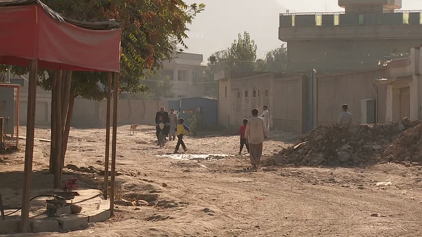 KABUL, AFGHANISTAN - CIRCA 2009: Pedestrians on street circa 2009 in Kabul, Afghanistan. Afghanistan is an impoverished and least developed country, one of the world's poorest.