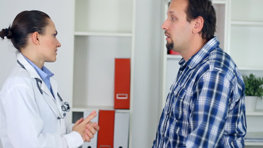 Female doctor telling bad news to male patient 