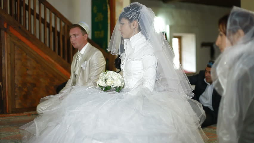 Crimean Tatar young couple at a wedding ceremony Nikah in a mosque Bakhchisaray Palace (Hansaray, Khan's Palace) Bakhchisaray, Crimea, Ukraine