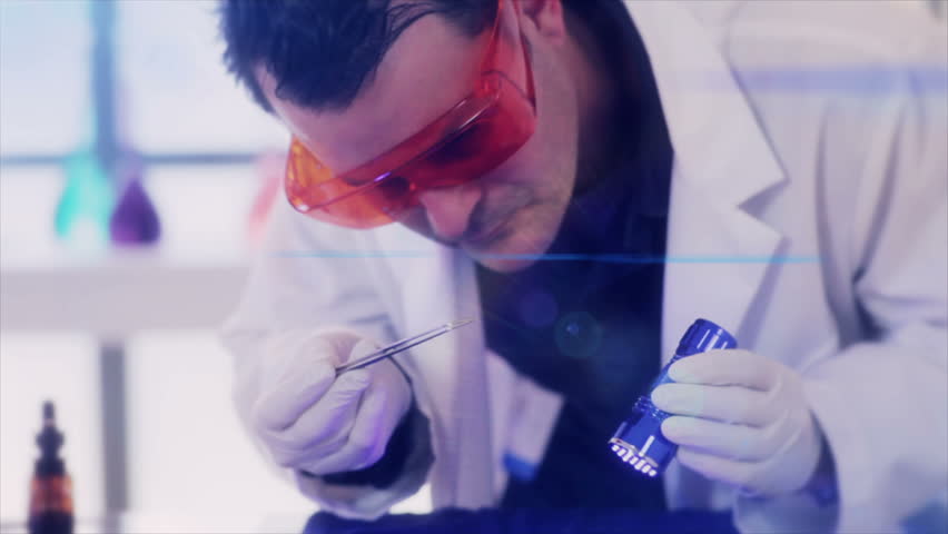 A crime scene investigator using a UV light to examine evidence on a sweater gathered from a crime scene. Affects added for drama.
