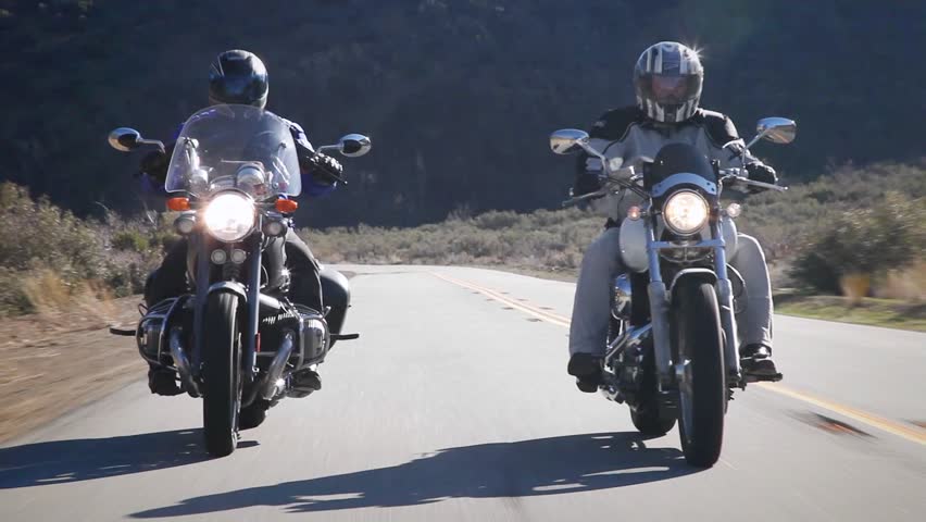 OJAI, CA - CIRCA 2009: Two people ride motorcycles out in the country circa 2009 in Ojai.