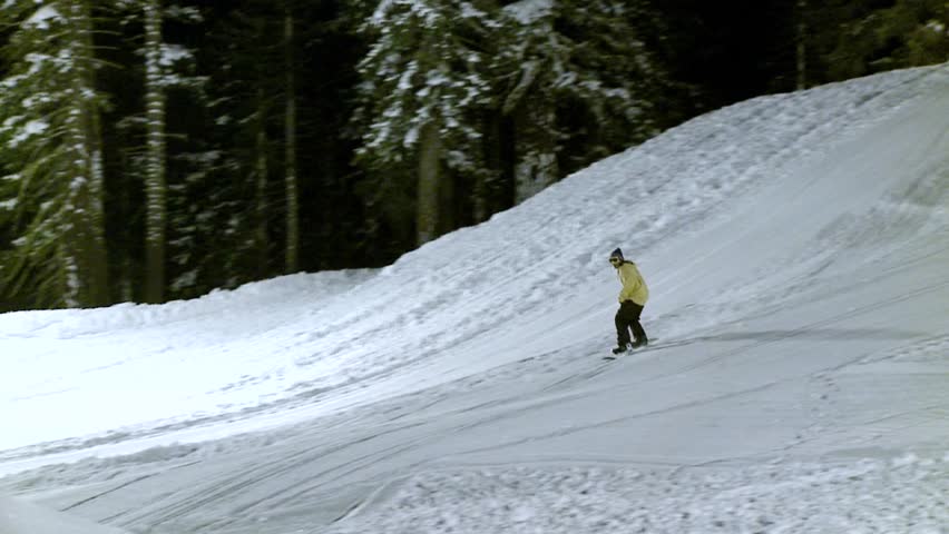 snowboarder performs a stunt on a metal cylinder circa 2009 in Lake Tahoe.