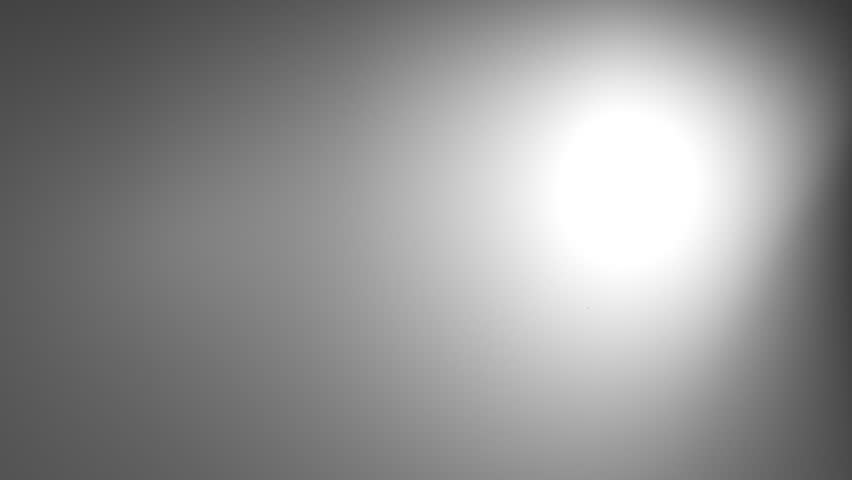 A drop of water disseminating onto a gray background.