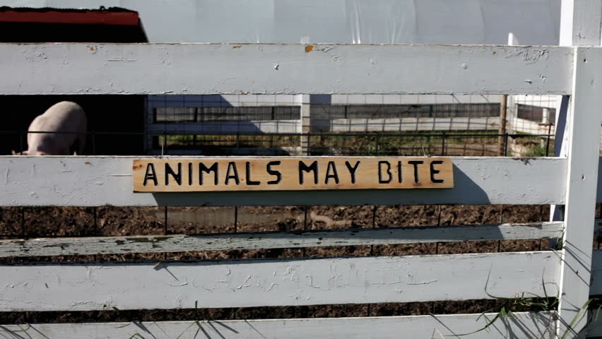 Animals may bite sign on pig pen
