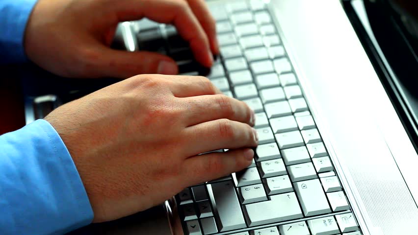 Closeup of a worker using a laptop computer 