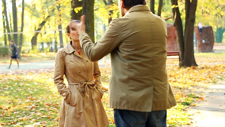 Young couple having fight in autumn park, slow motion