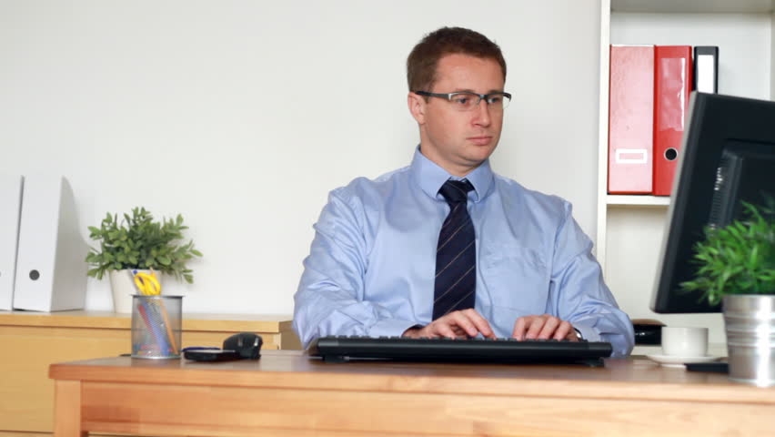 Businessman signing documents for co-worker