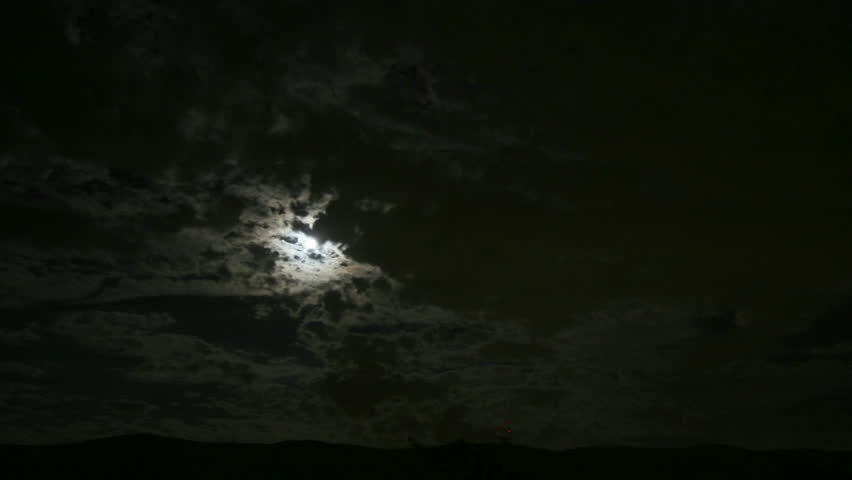 Haunting time-lapse of clouds passing over moon